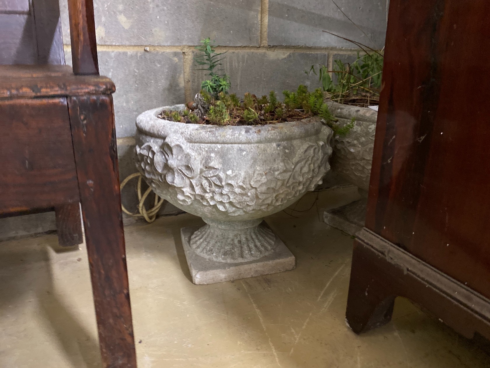A pair of circular reconstituted stone garden planters, diameter 38cm, height 33cm